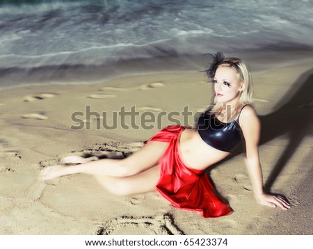 Fashion woman near the ocean. Long time exposure