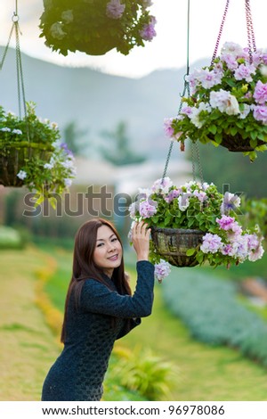 Beautiful south east asian girl and flowers