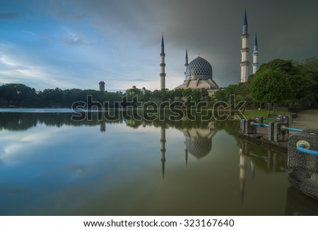 Masjid Sultan Salahuddin Abd Aziz Shah with Full Reflection on Cloudy Day 