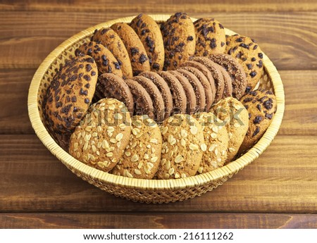 Oatmeal and chocolate cookies on the bamboo dish