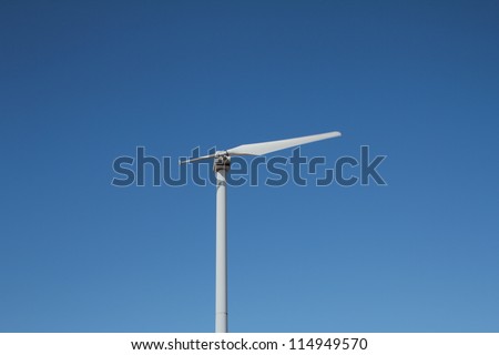 Single blade wind turbine in function on a windy day