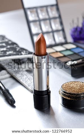 Makeup kit, lipstick on focus