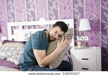 Tired man in vintage bedroom.