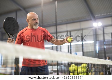 Similar – Image, Stock Photo senior man playing paddle tennis at indoors pitch, he is tired