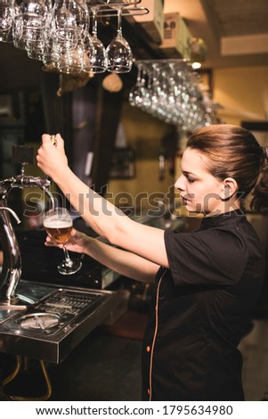 Similar – Foto Bild Kellnerin zapft Zapfhahn-Bier in einer Bar