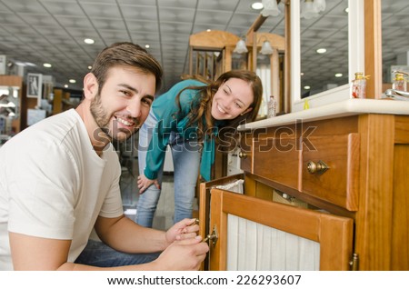 Couple buying furniture at big plumbing store