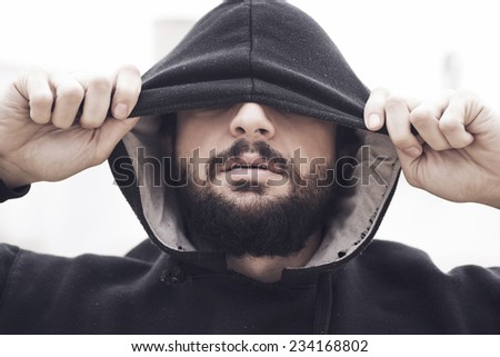 Image of hipster trendy man with hood.