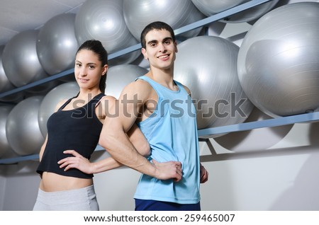 Young fitness couple at ballon room in gym