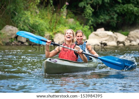 Similar – Image, Stock Photo Two kayaks on the water with reflection