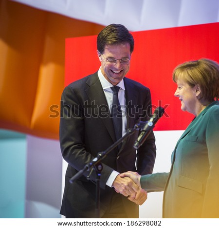 HANOVER, GERMANY - APRIL 7:  Dutch Prime Minister Mark Rutte and German Chancellor Angela Merkel opening the Hannover Messe. April 7, 2014.