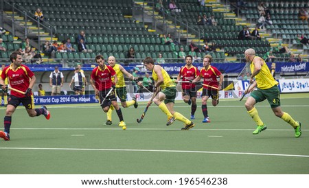 THE HAGUE, NETHERLANDS - JUNE 2: Australian Orchard is passing the Spanish defence during the Hockey World Cup 2014 in the preliminary match between Australia and Spain (men). AUS beats SPA 3-0