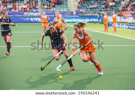 THE HAGUE, NETHERLANDS - JUNE 2: Dutch Hoog is lifting her stick to control the ball, Belgium player de Groof is trying to take over the ball during the Hockey World Cup 2014 NED beats BEL 4-0