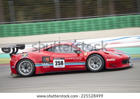 ASSEN, NETHERLANDS - OCTOBER 19, 2014: Ferrari at full speed during the supercar challenge and GT cup during Acceleration 2014 at the TT Circuit in Assen