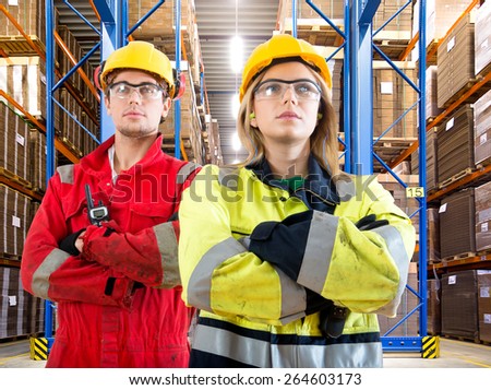 Two warehouse logistics employees looking confident as the new delivery arrives
