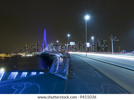 The famous Erasmus Bridge, approaching the steps leading to the boardwalk. The steps have drawings in chalk on them