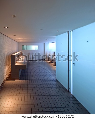 The slick architectural design of a man\'s room in a public building