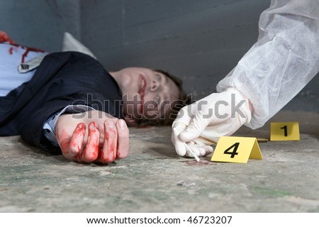 Forensic expert collecting evidence at the crime scene of a murdered businessman