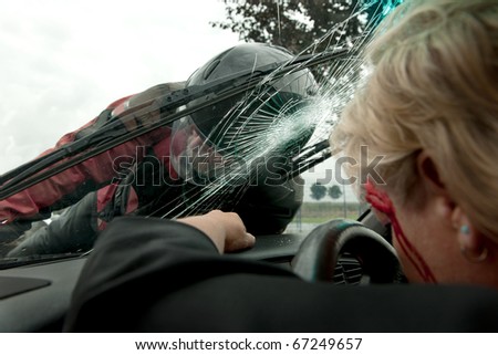 Frontal hit between a car and motorcycle as viewed from inside the car