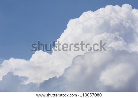 large cumulus clouds at blue sky