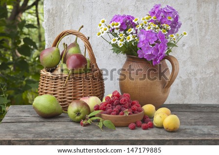 fruits and flowers at garden table