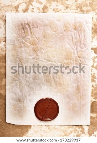 sheet of old paper with a wax seal on old paper background
