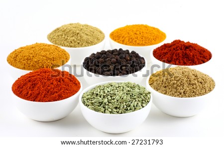 bowls of spice powders  on white background