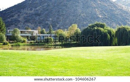Beautiful dream house in the country. A lot of grass in the garden and a little pond.