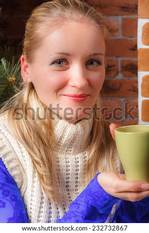 Close up of beautiful woman with mug of coffee