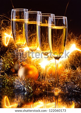 four champagne glasses ready to bring in the New Year