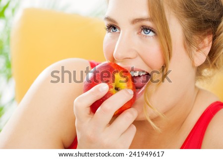 Young real woman with fresh fruits.