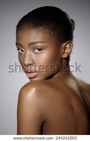 Beautiful African woman looking over the shoulder.