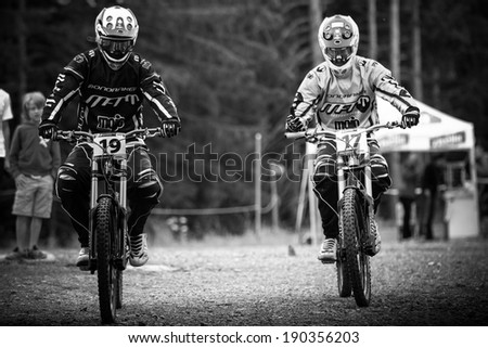 CHAMPERY, SWITZERLAND, SEPTEMBER 21 : French world record holders in DH MTB riding heading towards starting line before their run at the international downhill world championships on September 21 2011