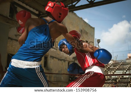 HAVANA, CUBA - JUNE 26: Unidentified young people boxing in the street of Havana. Havana, Cuba, June 26, 2013. Boxing is very popular in Cuba, a lot of people practicing in the street.