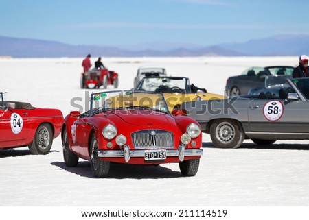 SALINAS GRANDES, ARGENTINA - MAY 04: Retro cars participating in run on the North of Argentina, Jujuy, Argentina, 04 May 2014. Salinas Grandes is located at the height of 3500 meters above sea level
