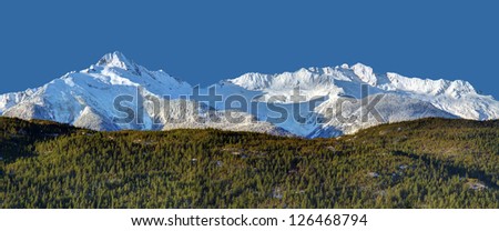 Snowy peaks of the Tantalus mountain range along the Sea to Sky Highway between Squamish and Whistler Resort, British Columbia, Canada
