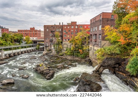 Magog river flowing in the heart of Sherbrooke city in Autumn, province of Quebec, Canada