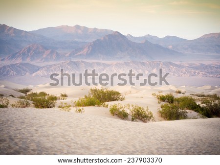 Sand Dunes And Mountains in sunset, Death Valley National Park, California, USA