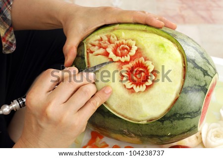Woman s hands carved watermelon show step