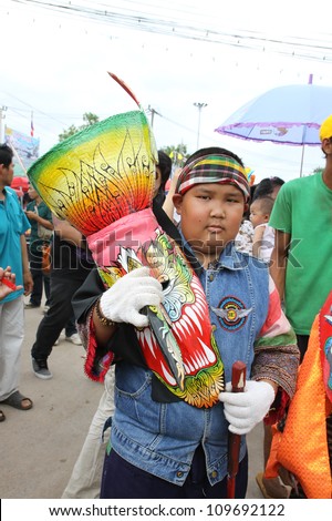 LOEI PROVINCE,THAILAND-JULY 23:Unidentified men wear ghost costumes at Ghost Festival (Phi Ta Khon - a masked procession celebrated by Buddhist) at Dan Sai district in Loei Province on July 23, 2012.