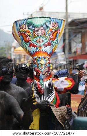 LOEI PROVINCE,THAILAND-JUNE 23:Unidentified men wear ghost costumes at Ghost Festival (Phi Ta Khon- a masked procession celebrated by Buddhist) at Dan Sai district in Loei Province on July 23, 2012.