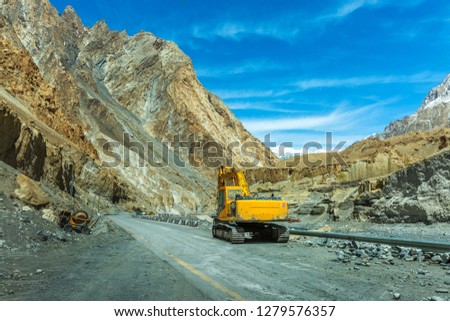 Heavy road construction car with heavy machine in Karakoram Highway in Pakistan mountains. India, Ladakh, altitude 4500 m Stok fotoğraf © 