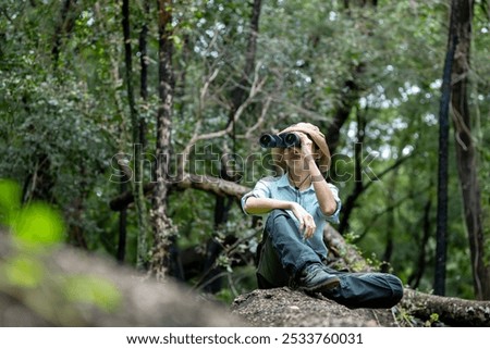 Similar – Image, Stock Photo Hiker observing forest in binoculars