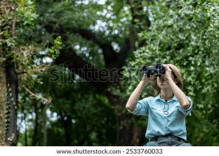 Similar – Image, Stock Photo Hiker observing forest in binoculars