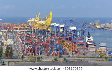 CHONBURI, THAILAND -April  20: Working crane bridge with Container Cargo in Leamchabang industry marine port and cargo ship during transfer goods on April 20, 2014 in Chonburi, Thailand.