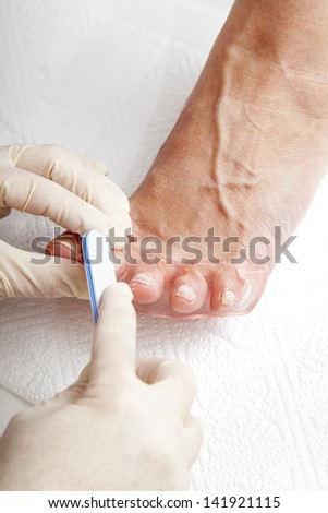 Process of foot nail varnishing, series of photos, Close up of a beautician preparing and applying a nail polish  to a client\'s feet, series of STEP BY STEP nail varnishing process,  selective focus