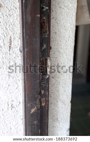 Damaged door and lock after housebreaking, close-up