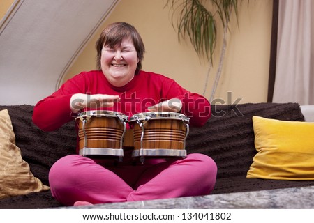 Mentally disabled woman enjoys her music therapy