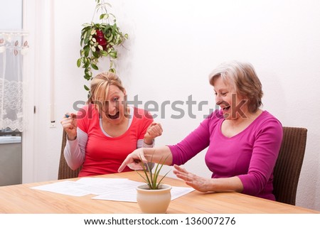 Two women are happy about positive message