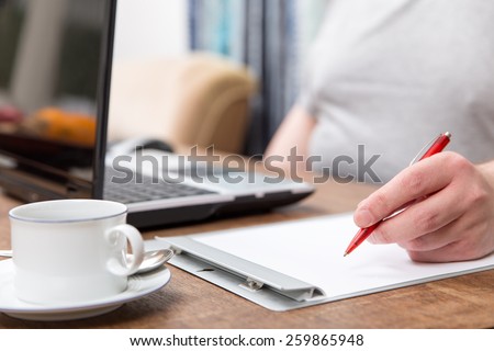 close up from a home office with a notebook and a notepad