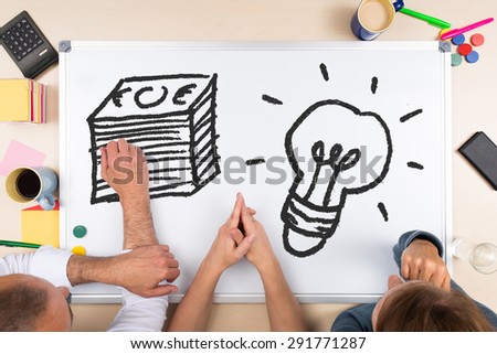 Top view whiteboard with drawings, concept money and business solutions
